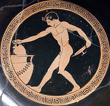 Boy  drawing wine from a crater. His nudity shows that heis serving as a cup bearer at a symposium or banquet.at a Greek symposium or banquet (